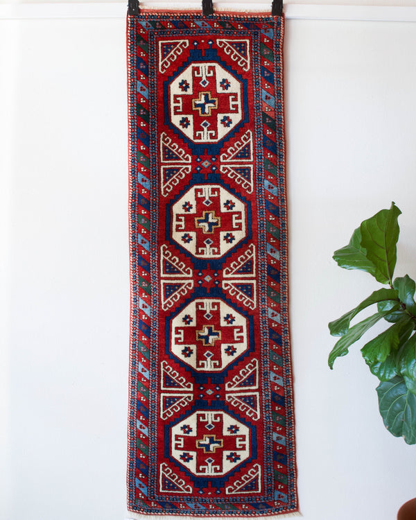 Vintage Turkish runner rug in a living room setting, pile rug, Turkish rug, vintage rug, portland, rug shop, bright colors, wild shaman, soft rug, bold color, Portland, Oregon, rug store, rug shop, local shop, antique rug