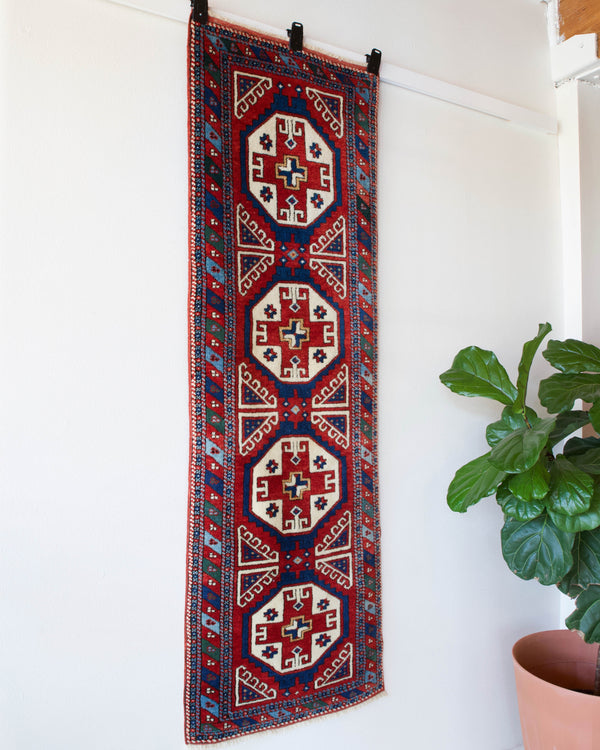 Vintage Turkish runner rug in a living room setting, pile rug, Turkish rug, vintage rug, portland, rug shop, bright colors, wild shaman, soft rug, bold color, Portland, Oregon, rug store, rug shop, local shop, antique rug