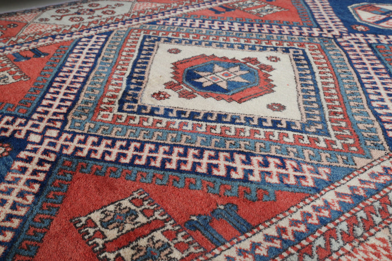 Vintage Turkish rug in living room setting, old rug, antique rug, pastel colors, faded colors, Turkish rug, vintage rug, soft rug, Portland, Oregon, rug store, rug shop, local shop, pastel colors