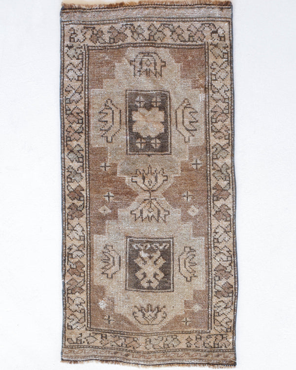 Vintage Turkish mini rug in room decor setting, old rug, antique rug, pastel colors, faded colors, Turkish rug, vintage rug, soft rug, Portland, Oregon, rug store, rug shop, local shop