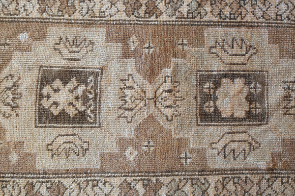 Vintage Turkish mini rug in room decor setting, old rug, antique rug, pastel colors, faded colors, Turkish rug, vintage rug, soft rug, Portland, Oregon, rug store, rug shop, local shop