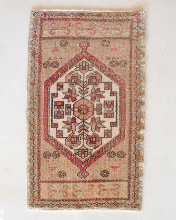 Vintage Turkish mini rug in room decor setting, old rug, antique rug, pastel colors, faded colors, Turkish rug, vintage rug, soft rug, Portland, Oregon, rug store, rug shop, local shop