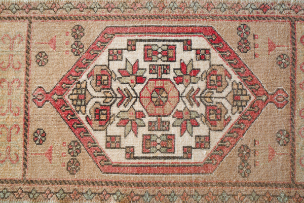 Vintage Turkish mini rug in room decor setting, old rug, antique rug, pastel colors, faded colors, Turkish rug, vintage rug, soft rug, Portland, Oregon, rug store, rug shop, local shop