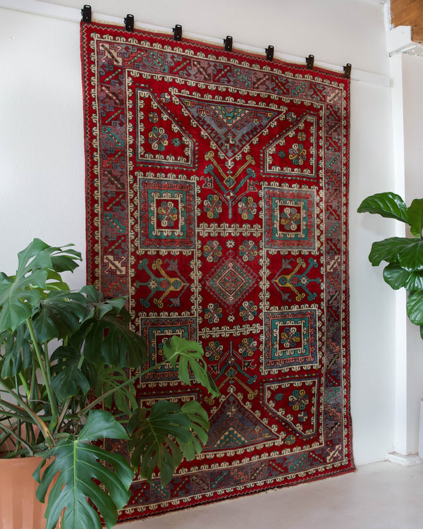 Vintage Turkish rug in a living room setting, pile rug, Turkish rug, vintage rug, portland, rug shop, bright colors, wild shaman, soft rug, bold color, Portland, Oregon, rug store, rug shop, local shop