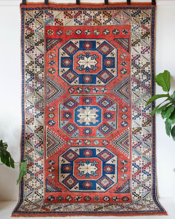 Vintage Turkish rug in living room setting, old rug, antique rug, pastel colors, faded colors, Turkish rug, vintage rug, soft rug, Portland, Oregon, rug store, rug shop, local shop