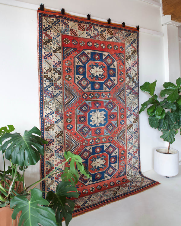 Vintage Turkish rug in living room setting, old rug, antique rug, pastel colors, faded colors, Turkish rug, vintage rug, soft rug, Portland, Oregon, rug store, rug shop, local shop