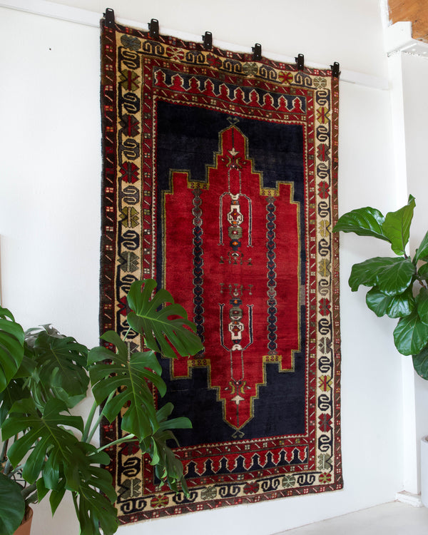  Vintage Turkish rug in a living room setting, pile rug, Turkish rug, vintage rug, portland, rug shop, bright colors, wild shaman, soft rug, bold color, Portland, Oregon, rug store, rug shop, local shop