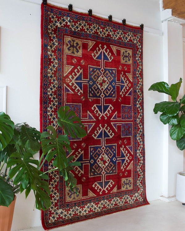 Vintage Turkish rug in a living room setting, pile rug, Turkish rug, vintage rug, portland, rug shop, bright colors, wild shaman, soft rug, bold color, Portland, Oregon, rug store, rug shop, local shop