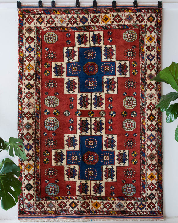 Vintage Turkish rug in a living room setting, pile rug, Turkish rug, vintage rug, portland, rug shop, bright colors, wild shaman, soft rug, bold color, Portland, Oregon, rug store, rug shop, local shop