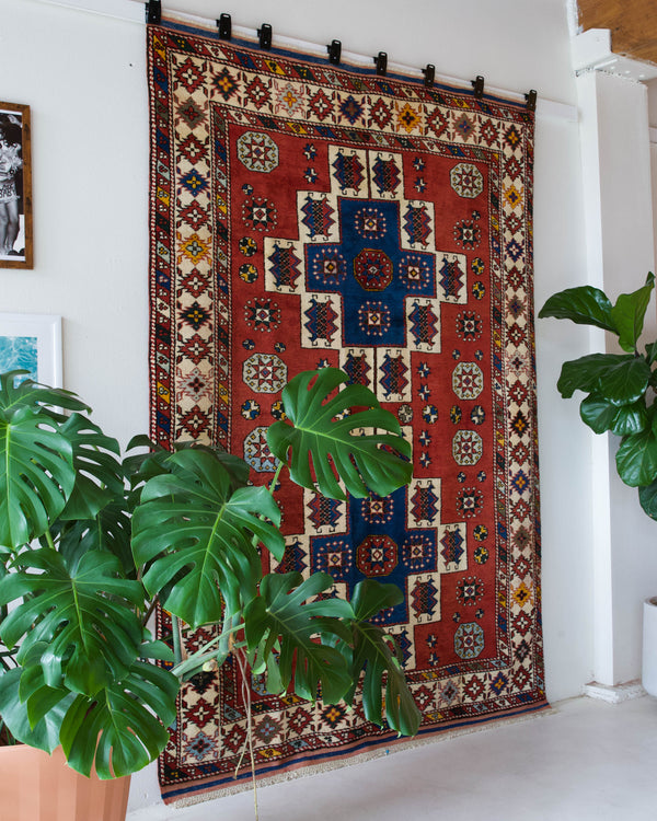 Vintage Turkish rug in a living room setting, pile rug, Turkish rug, vintage rug, portland, rug shop, bright colors, wild shaman, soft rug, bold color, Portland, Oregon, rug store, rug shop, local shop