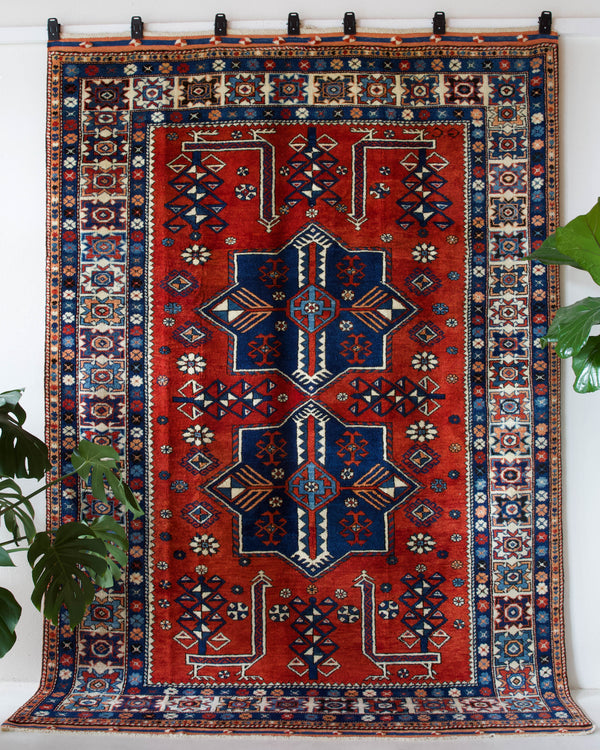 Vintage Turkish rug in a living room setting, pile rug, Turkish rug, vintage rug, portland, rug shop, bright colors, wild shaman, soft rug, bold color, Portland, Oregon, rug store, rug shop, local shop