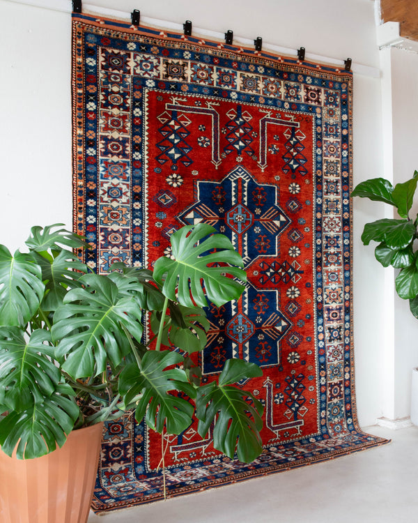 Vintage Turkish rug in a living room setting, pile rug, Turkish rug, vintage rug, portland, rug shop, bright colors, wild shaman, soft rug, bold color, Portland, Oregon, rug store, rug shop, local shop