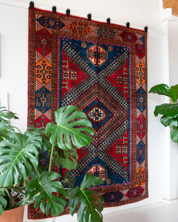 Vintage Turkish rug in a living room setting, pile rug, Turkish rug, vintage rug, portland, rug shop, bright colors, wild shaman, soft rug, bold color, Portland, Oregon, rug store, rug shop, local shop