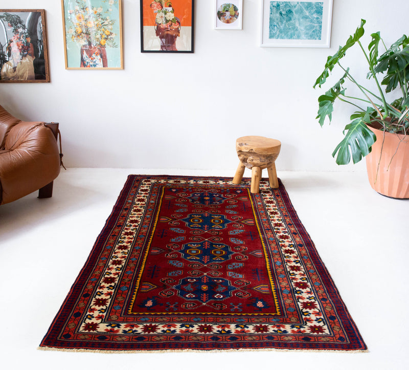 Vintage Turkish rug in a living room setting, pile rug, Turkish rug, vintage rug, portland, rug shop, bright colors, wild shaman, soft rug, bold color, Portland, Oregon, rug store, rug shop, local shop