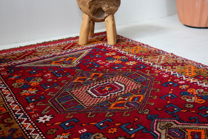 Vintage Turkish rug in a living room setting, pile rug, Turkish rug, vintage rug, portland, rug shop, bright colors, wild shaman, soft rug, bold color, Portland, Oregon, rug store, rug shop, local shop