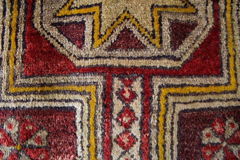 Vintage Turkish rug in a living room setting, pile rug, Turkish rug, vintage rug, portland, rug shop, bright colors, wild shaman, soft rug, bold color, Portland, Oregon, rug store, rug shop, local shop, antique rug, distressed rug, worn out rug
