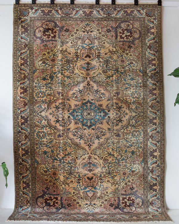 Vintage Turkish rug in living room setting, old rug, antique rug, pastel colors, faded colors, Turkish rug, vintage rug, soft rug, Portland, Oregon, rug store, rug shop, local shop