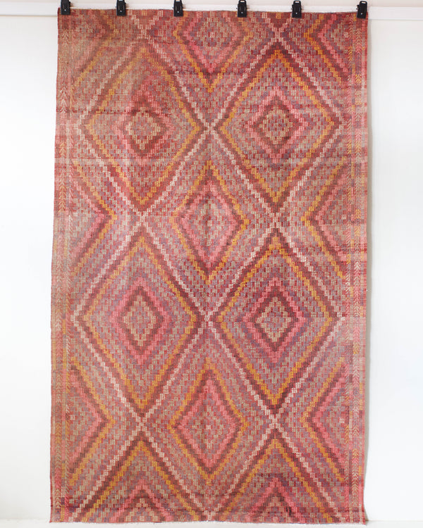 Vintage kilim rug in living room setting, old rug, antique rug, pastel colors, faded colors, Turkish rug, vintage rug, soft rug, Portland, Oregon, rug store, rug shop, local shop