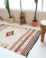  Vintage kilim rug in room decor setting, old rug, antique rug, pastel colors, faded colors, Turkish rug, vintage rug, soft rug, Portland, Oregon, rug store, rug shop, local shop, antique rug