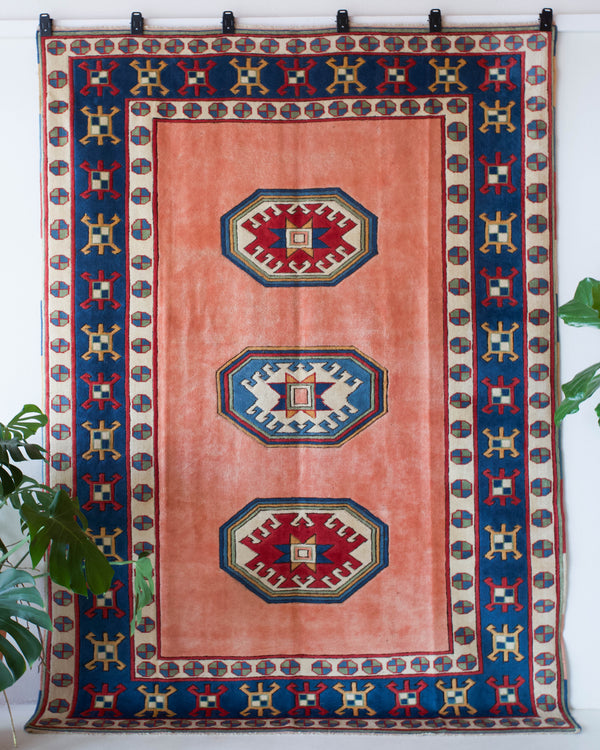 Vintage Turkish rug in a living room setting, pile rug, Turkish rug, vintage rug, portland, rug shop, bright colors, wild shaman, soft rug, bold color, Portland, Oregon, rug store, rug shop, local shop