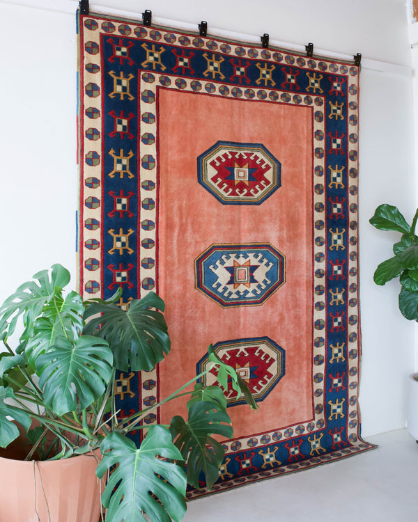 Vintage Turkish rug in a living room setting, pile rug, Turkish rug, vintage rug, portland, rug shop, bright colors, wild shaman, soft rug, bold color, Portland, Oregon, rug store, rug shop, local shop