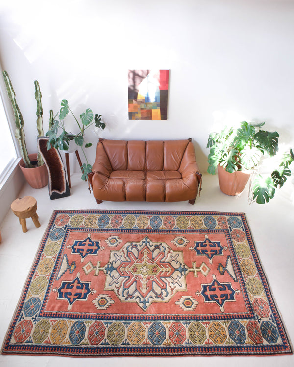 Vintage caucasian rug in a living room setting, pile rug, Turkish rug, vintage rug, portland, rug shop, bright colors, wild shaman, soft rug, bold color, Portland, Oregon, rug store, rug shop, local shop, soft rug, pastel colors, faded colors