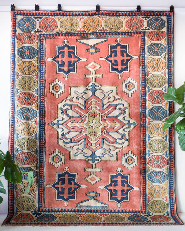 Vintage caucasian rug in a living room setting, pile rug, Turkish rug, vintage rug, portland, rug shop, bright colors, wild shaman, soft rug, bold color, Portland, Oregon, rug store, rug shop, local shop, soft rug, pastel colors, faded colors