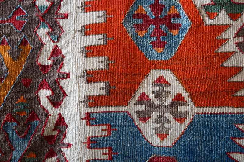 Antique kilim rug in living room setting, bright colors, wild shaman, soft rug, bold color, Portland, Oregon, rug store, rug shop, local shop, vintage rug, modern kilim, antique kilim, antique