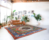 Vintage Turkish rug in a living room setting, pile rug, Turkish rug, vintage rug, portland, rug shop, bright colors, wild shaman, soft rug, bold color, Portland, Oregon, rug store, rug shop, local shop