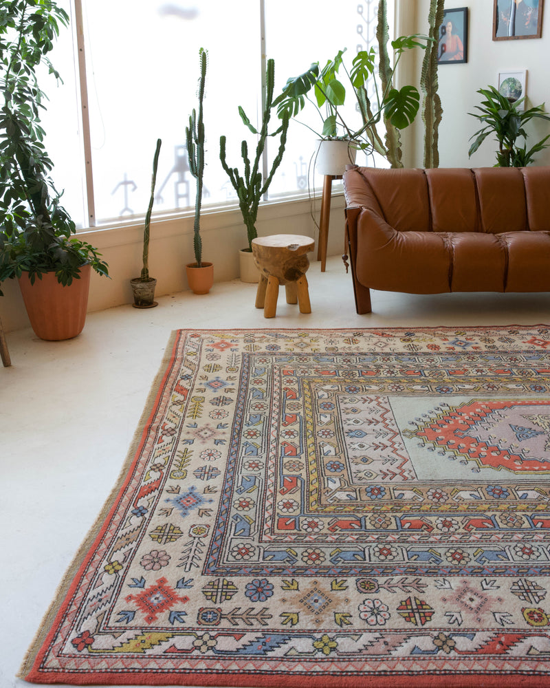 Vintage Turkish rug in living room setting, old rug, antique rug, pastel colors, faded colors, Turkish rug, vintage rug, soft rug, Portland, Oregon, rug store, rug shop, local shop