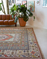 Vintage Turkish rug in living room setting, old rug, antique rug, pastel colors, faded colors, Turkish rug, vintage rug, soft rug, Portland, Oregon, rug store, rug shop, local shop