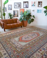 Vintage Turkish rug in living room setting, old rug, antique rug, pastel colors, faded colors, Turkish rug, vintage rug, soft rug, Portland, Oregon, rug store, rug shop, local shop