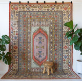 Vintage Turkish rug in living room setting, old rug, antique rug, pastel colors, faded colors, Turkish rug, vintage rug, soft rug, Portland, Oregon, rug store, rug shop, local shop