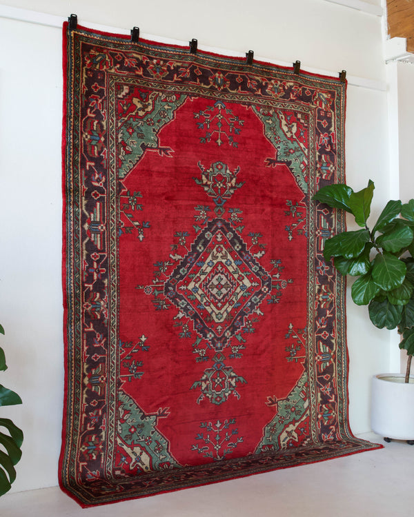 Vintage Turkish rug in a living room setting, pile rug, Turkish rug, vintage rug, portland, rug shop, bright colors, wild shaman, soft rug, bold color, Portland, Oregon, rug store, rug shop, local shop, antique rug