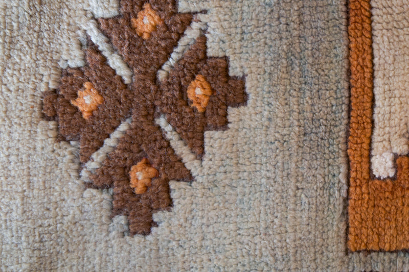 Vintage caucasian rug in a living room setting, pastel colors, faded colors, Turkish rug, vintage rug, soft rug, Portland, Oregon, rug store, rug shop, local shop