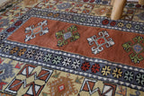 Vintage Turkish rug in a living room setting, pile rug, Turkish rug, vintage rug, portland, rug shop, bright colors, wild shaman, soft rug, bold color, Portland, Oregon, rug store, rug shop, local shop, antique rug,  sun colors, warm colors