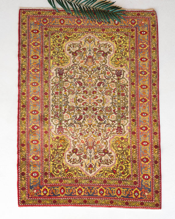 Vintage Turkish rug in a living room setting, pile rug, Turkish rug, vintage rug, portland, rug shop, bright colors, wild shaman, soft rug, bold color, Portland, Oregon, rug store, rug shop, local shop, antique rug, floral rug