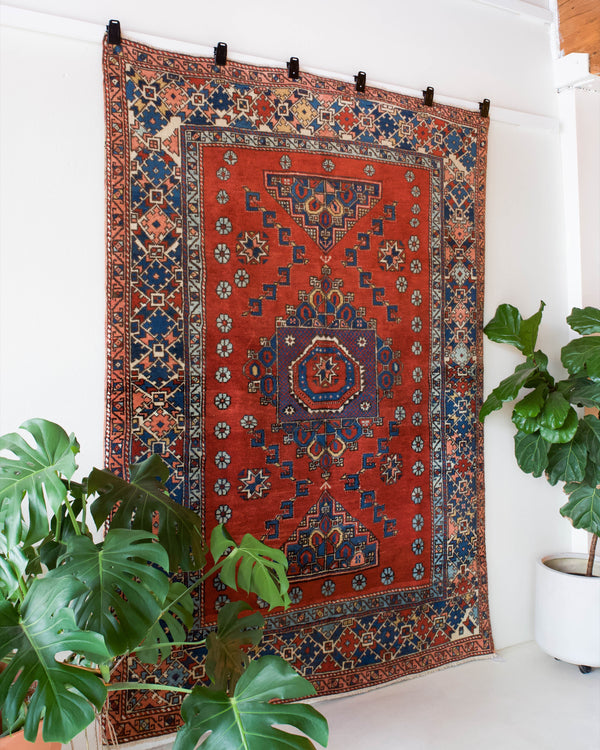 Vintage Turkish rug in a living room setting, pile rug, Turkish rug, vintage rug, portland, rug shop, bright colors, wild shaman, soft rug, bold color, Portland, Oregon, rug store, rug shop, local shop, antique rug