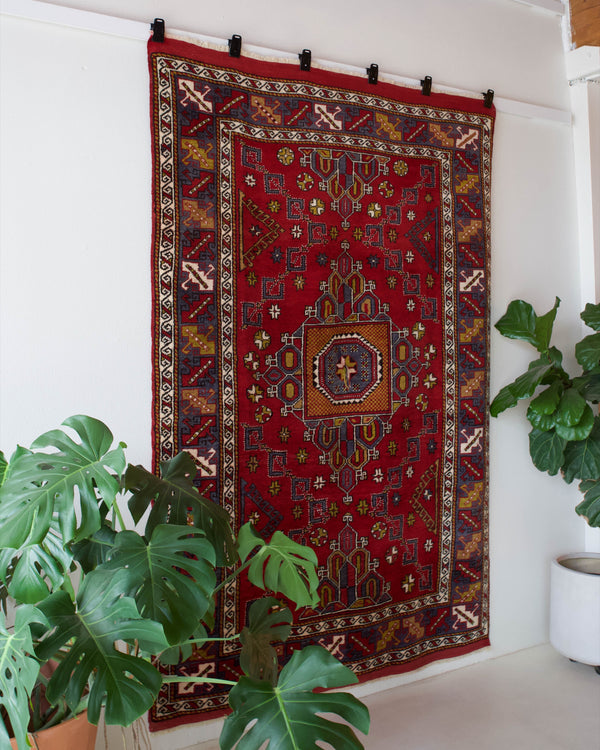 Vintage Turkish rug in a living room setting, pile rug, Turkish rug, vintage rug, portland, rug shop, bright colors, wild shaman, soft rug, bold color, Portland, Oregon, rug store, rug shop, local shop, antique rug