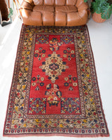 Vintage Turkish rug in a living room setting, pile rug, Turkish rug, vintage rug, portland, rug shop, bright colors, wild shaman, soft rug, bold color, Portland, Oregon, rug store, rug shop, local shop, antique rug, 