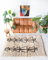Vintage Turkish rug in living room setting, old rug, antique rug, pastel colors, faded colors, Turkish rug, vintage rug, soft rug, Portland, Oregon, rug store, rug shop, local shop, undyed rug, natural colors