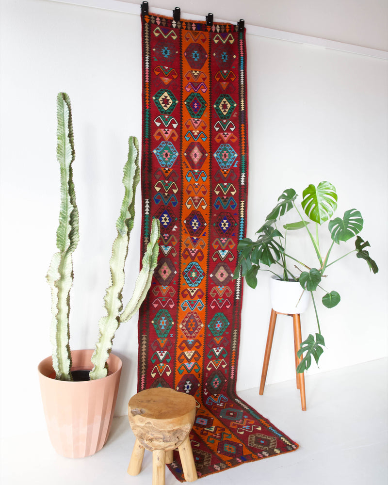  Vintage Turkish runner rug in a living room setting, pile rug, Turkish rug, vintage rug, portland, rug shop, bright colors, wild shaman, soft rug, bold color, Portland, Oregon, rug store, rug shop, local shop, antique rug