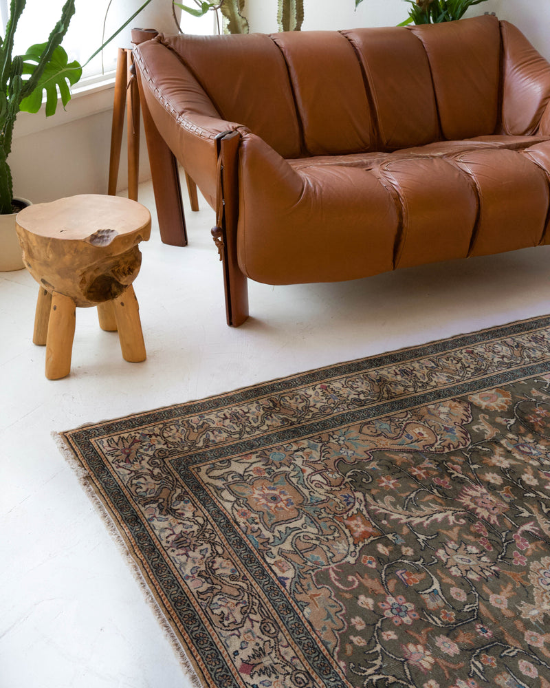 Vintage Turkish rug in living room setting, old rug, antique rug, pastel colors, faded colors, Turkish rug, vintage rug, soft rug, Portland, Oregon, rug store, rug shop, local shop