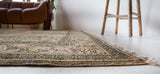 Vintage Turkish rug in living room setting, old rug, antique rug, pastel colors, faded colors, Turkish rug, vintage rug, soft rug, Portland, Oregon, rug store, rug shop, local shop